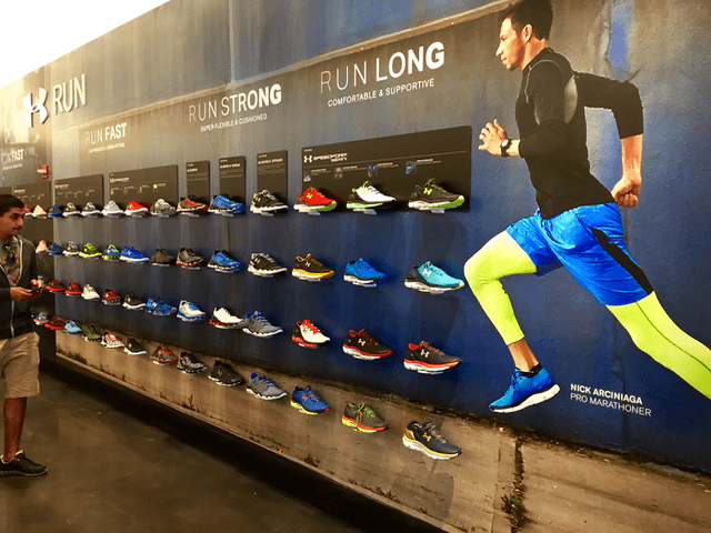 Running shoes displayed with wall vinyl graphic